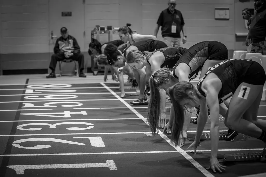 Track sprinters at starting line